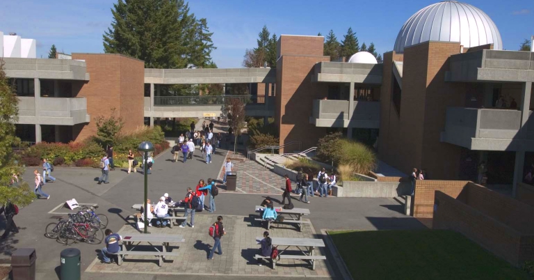 students on campus outside talking